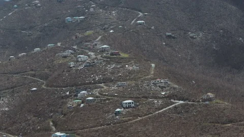 View of destroyed homes from hurricane Irma on hillside in Coral Bay Stock Footage 83492593