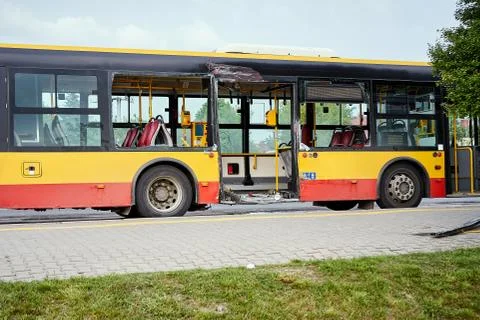 View of devastated city bus after road accident. Stock Photos