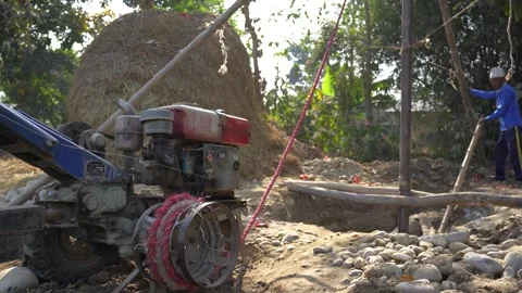 View of a diesel engine powering a drilling rig in Nepal. Video stock 335471592