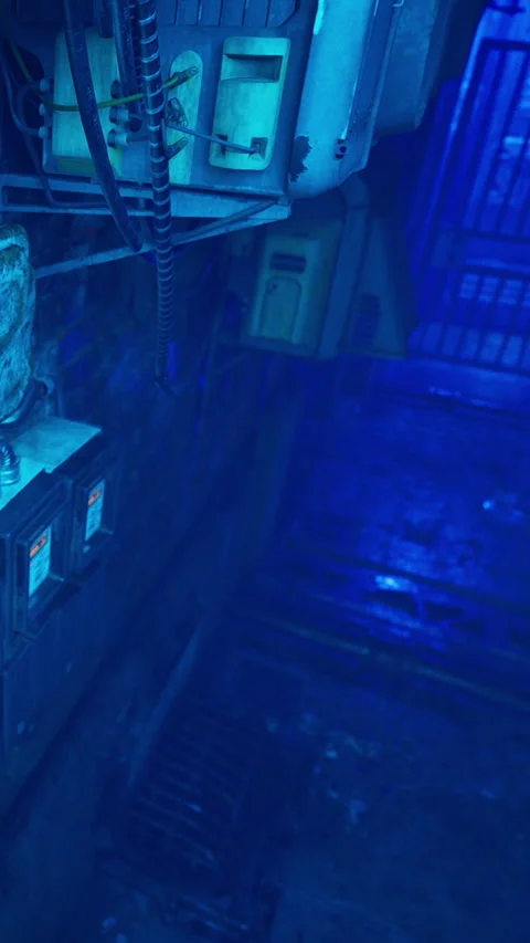 View of a dimly lit industrial space with electrical boxes and blue light Stock Footage 340893626