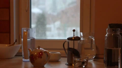View of dining objects and snow outside the window Stock Footage 151446341
