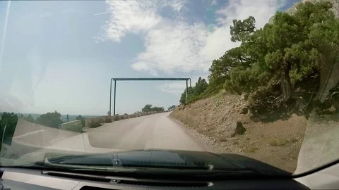 View on dirt road from a moving car. Summer road trip through the beautiful Stock Footage 70674630