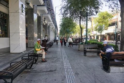 View of disability friendly sidewalk facilities with tactile paving tiles Stock Photos
