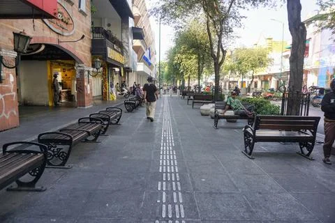 View of disability friendly sidewalk facilities with tactile paving tiles Stock Photos