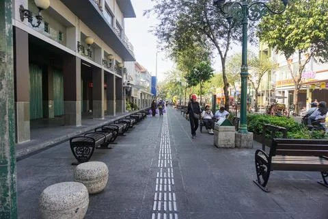View of disability friendly sidewalk facilities with tactile paving tiles Stock Photos
