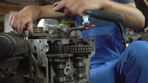 View of disassembled car engine. hands of mechanic repairing engine Stock Footage 158301026