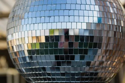 View of a disco ball. It consists of numerous small reflective mirrored tiles Stock Photos