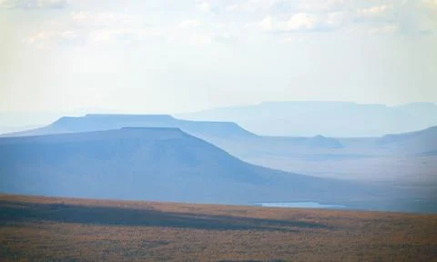 View of the distant typical mountains of the Putorana plateau from  helicopte Stock Photos