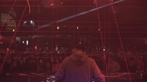 View of DJ from the back who plays in a nightclub Stock-Footage 126358549