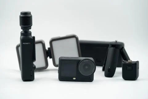 View of DJI Pocket 3, Action 6 and accessories on white background. Toronto, Stock Photos