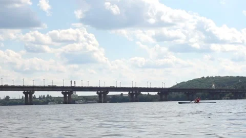 View of the Dnieper River with a kayak and a bridge. Stock Footage 187541453