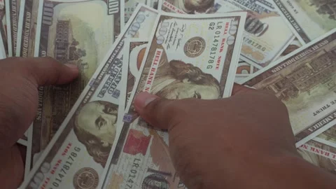 View of dollar bills. Counting dollar bills. Stock Footage 329954659