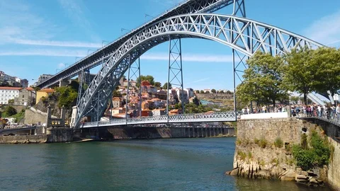 The view of Dom Luis I Bridge, the old town, and Douro River in Porto, Portugal Stock Footage 125238793