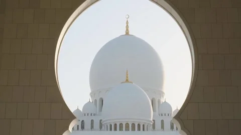 View of Domes of Sheikh Zayed Grand Mosque in Abu Dhabi, UAE framed by ornate Stock Footage 284347758