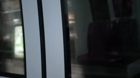 View to the door glasses window of subway train commuter while train leavin.. Stock Footage 248962497