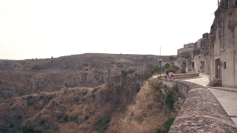 A view on a door open over a gorgeous background of Matera downtown Stock Footage 121339832