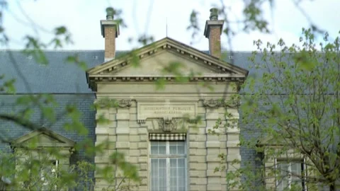 View of dormer windows, chimneys and rooftop of Institut Pasteur in Paris, Franc Stock Footage 163175108