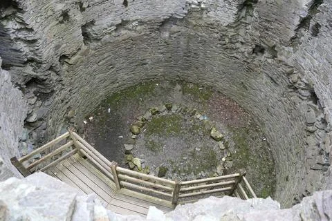 View Down Into Ancient Stone Tower Or Well, Llanberis, North Wales. Photos