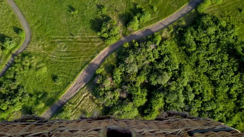 View down from the balloon basket onto a sunny summer meadow Stock Footage 265790271