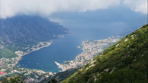 View down to the bay of Kotor with fast moving clouds, timelapse Stock Footage 95204510