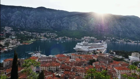 View down to the bay of Kotor with a large cruise ship at sunset, timelapse Vídeo Stock 95291734