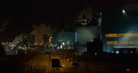 View down from a bridge on a Steel mill production plant at night in Duisburg Stock Footage 124398972