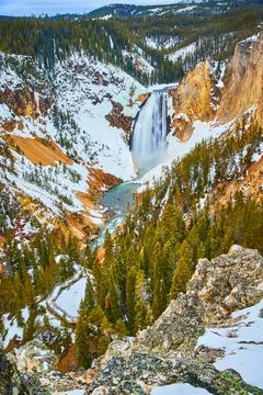 View down canyon in winter of stunning Upper Falls at Yellowstone Stock Photos