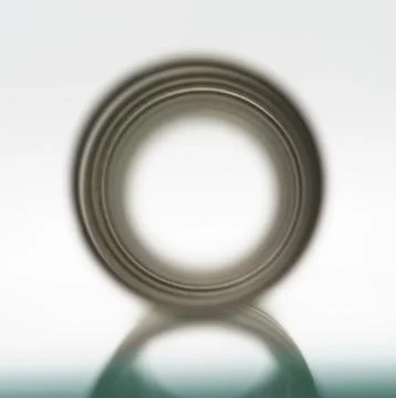 The view down the center of a spring on a sheet of glass Foto stock