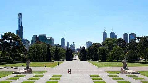 A view down into the central business district. Bright blue sky, green grass  Stock Footage 87341334