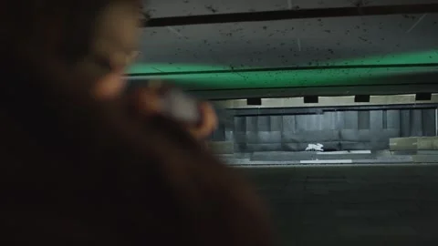 View Down Indoor Shooting Lane to Paper Target, Green Light, Over Shoulder Видео 341318995