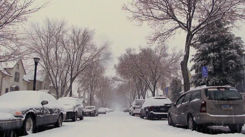 View down middle of Snowy unplowed Suburban street scene minneapolis, mn Video stock 34195513