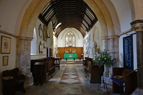 View Down the Nave Aisle to the Altar and Chancel of St Thomas  Becket Church Stock Photos