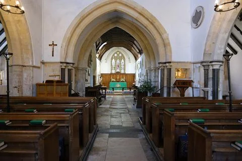 View Down Nave Aisle of St Thomas  Becket Church Towards Arches and Altar Stock Photos