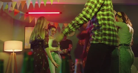 View from down ober the table with bottles on it - young Caucasian guys and Stock Footage 122508429