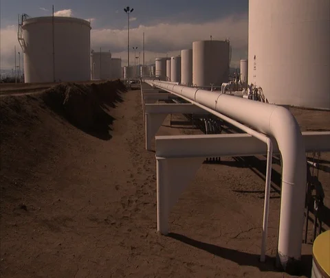 View down pipeline of oil storage tanks Stock Footage 86748291