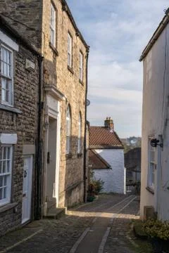 A view down a pretty cobbled side street in Richmond, North Yorkshire Stock Photos