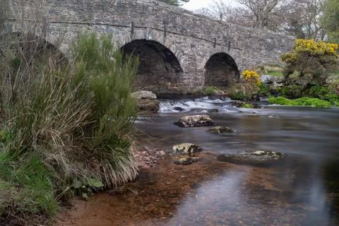 View down the river Postbridge, Dartmoor, Devon of a 13th Century granite bri Stock Photos