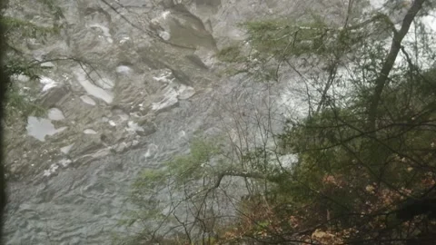 View down a steep embankment at a stream 스톡 동영상 166481106