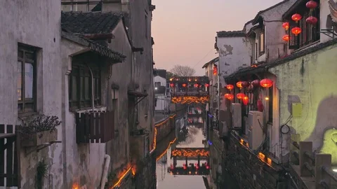 View down the Suzhou Canal with small boats floating Stock Footage 76649010