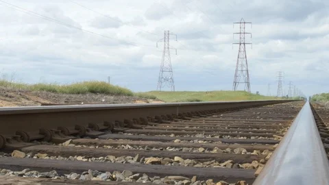 View down train tracks daytime low angle slow movement 스톡 동영상 89064184