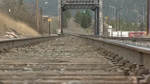 View Down Train Tracks Toward Bridge in Bonner/Milltown Stock Footage 105956519