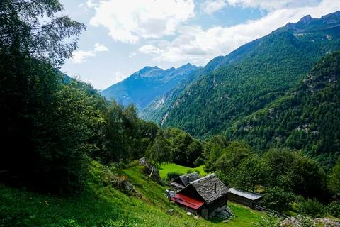 View down the Val Lavizzara over alp with traditional houses near Fusio, Swit Stock Photos