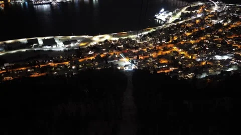 View down at wires and hillside from inside Fjellheisen cable car in Tromso Stock Footage 301467863