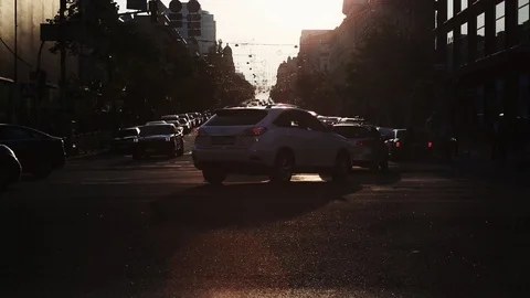 View of a downtown intersection during golden hour evening. Street view cars cro 库存影片 108410265