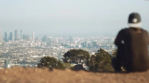 View of Downtown LA with Backwards Cap Teen in Foreground Stock Footage 64618468