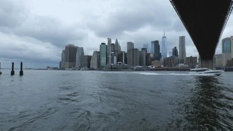 A view of the downtown Manhattan from under the bridge across East River. Stock Footage 310622699