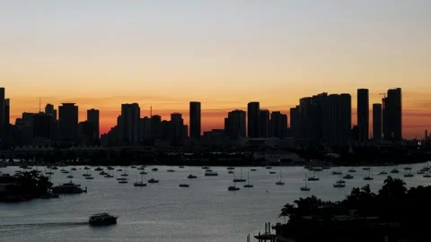 View of Downtown Miami after sunset. Skyline silhouetted against colorful sky Stock Footage 295551791