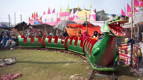 View of a dragon-themed carnival train ride, Bangladesh. Video stock 335016563