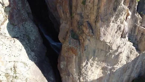 View of dramatic rock chasm with deep mountain waterfall rift in Kazakhstan Stock Footage 338117114