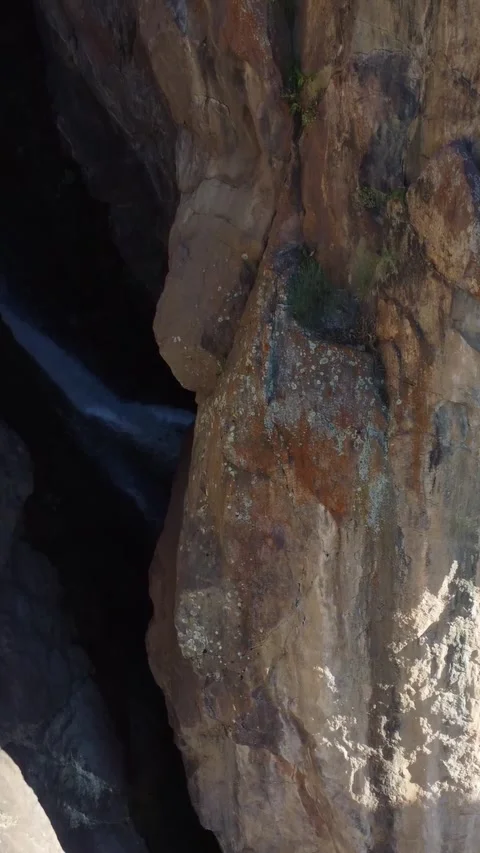View of dramatic rock chasm with deep mountain waterfall rift in Kazakhstan Stock Footage 338128894